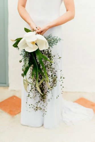single bloom wedding bouquets with greenary and magnolia leandry kers photography 2