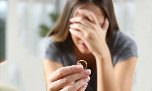 divorced woman holding ring 500