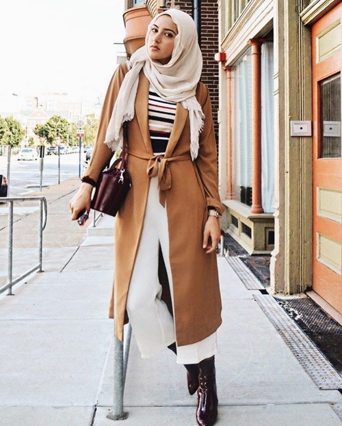camel coat with striped colorful sweater